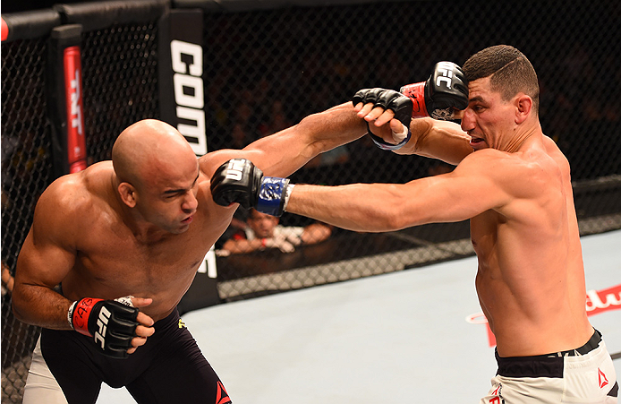 RIO DE JANEIRO, BRAZIL - AUGUST 01: (L-R) Warlley Alves of Brazil punches Nordine Taleb of Canada in their welterweight bout during the UFC 190 event inside HSBC Arena on August 1, 2015 in Rio de Janeiro, Brazil. (Photo by Josh Hedges/Zuffa LLC/Zuffa LL
