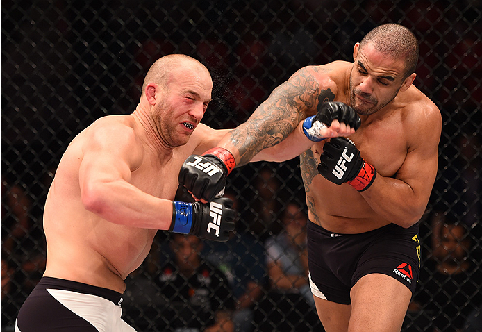 RIO DE JANEIRO, BRAZIL - AUGUST 01: (L-R) Patrick Cummins of the United States exchanges punches with Rafael Feijao of Brazil in their light heavyweight bout during the UFC 190 event inside HSBC Arena on August 1, 2015 in Rio de Janeiro, Brazil. (Photo