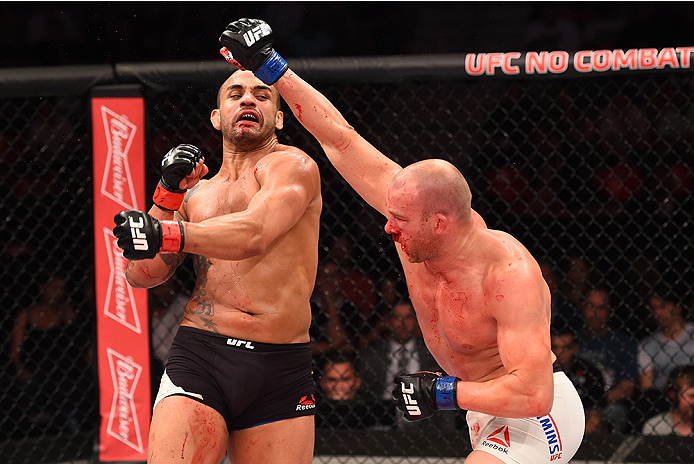 RIO DE JANEIRO, BRAZIL - AUGUST 01: (R-L) Patrick Cummins of the United States exchanges punches with Rafael Feijao of Brazil in their light heavyweight bout during the UFC 190 event inside HSBC Arena on August 1, 2015 in Rio de Janeiro, Brazil. (Photo