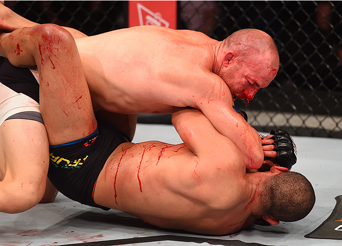 RIO DE JANEIRO, BRAZIL - AUGUST 01: Patrick Cummins of the United States (top) elbows Rafael Feijao of Brazil in their light heavyweight bout during the UFC 190 event inside HSBC Arena on August 1, 2015 in Rio de Janeiro, Brazil. (Photo by Josh Hedges/Z