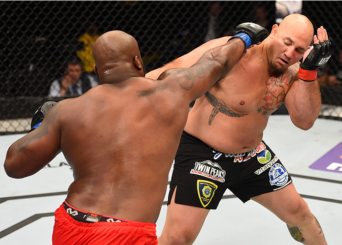 NEW ORLEANS, LA - JUNE 06: (L-R) Derrick Lewis punches Shawn Jordan in their heavyweight bout during the UFC event at the Smoothie King Center on June 6, 2015 in New Orleans, Louisiana. (Photo by Josh Hedges/Zuffa LLC/Zuffa LLC via Getty Images)