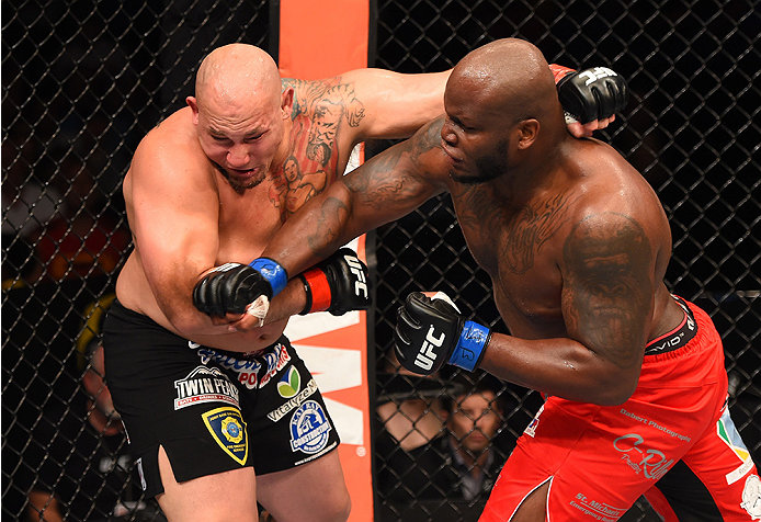 NEW ORLEANS, LA - JUNE 06: (R-L) Derrick Lewis punches Shawn Jordan in their heavyweight bout during the UFC event at the Smoothie King Center on June 6, 2015 in New Orleans, Louisiana. (Photo by Josh Hedges/Zuffa LLC/Zuffa LLC via Getty Images)