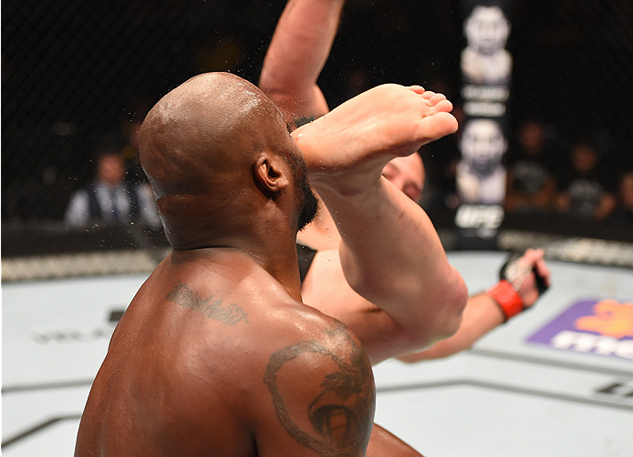 NEW ORLEANS, LA - JUNE 06: Shawn Jordan kicks Derrick Lewis in their heavyweight bout during the UFC event at the Smoothie King Center on June 6, 2015 in New Orleans, Louisiana. (Photo by Josh Hedges/Zuffa LLC/Zuffa LLC via Getty Images)