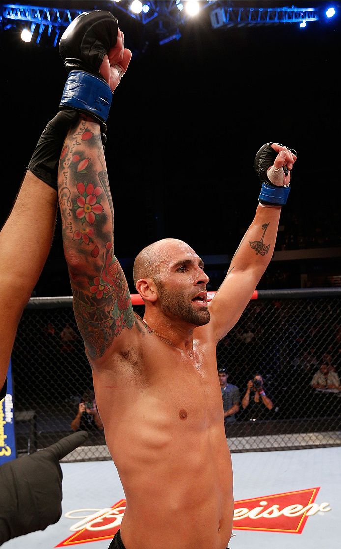 BRASILIA, BRAZIL - SEPTEMBER 13: George Sullivan celebrates after his knockout victory over Igor Araujo of Brazil in their welterweight bout during the UFC Fight Night event inside Nilson Nelson Gymnasium on September 13, 2014 in Brasilia, Brazil. (Photo