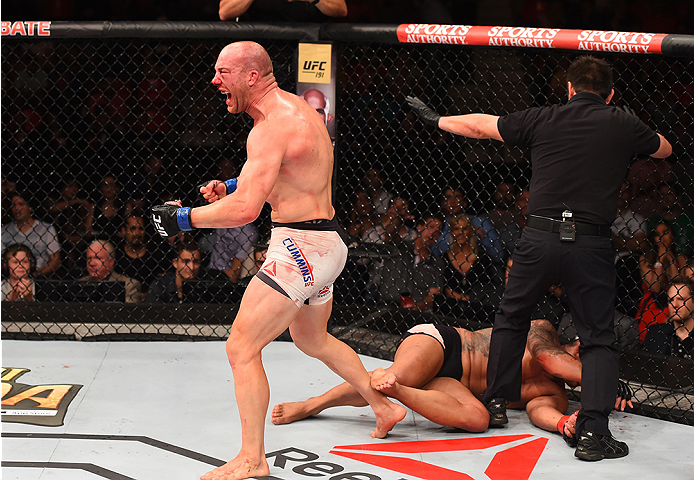 RIO DE JANEIRO, BRAZIL - AUGUST 01: (L-R) Patrick Cummins of the United States celebrates his victory over Rafael Feijao of Brazil in their light heavyweight bout during the UFC 190 event inside HSBC Arena on August 1, 2015 in Rio de Janeiro, Brazil. (P