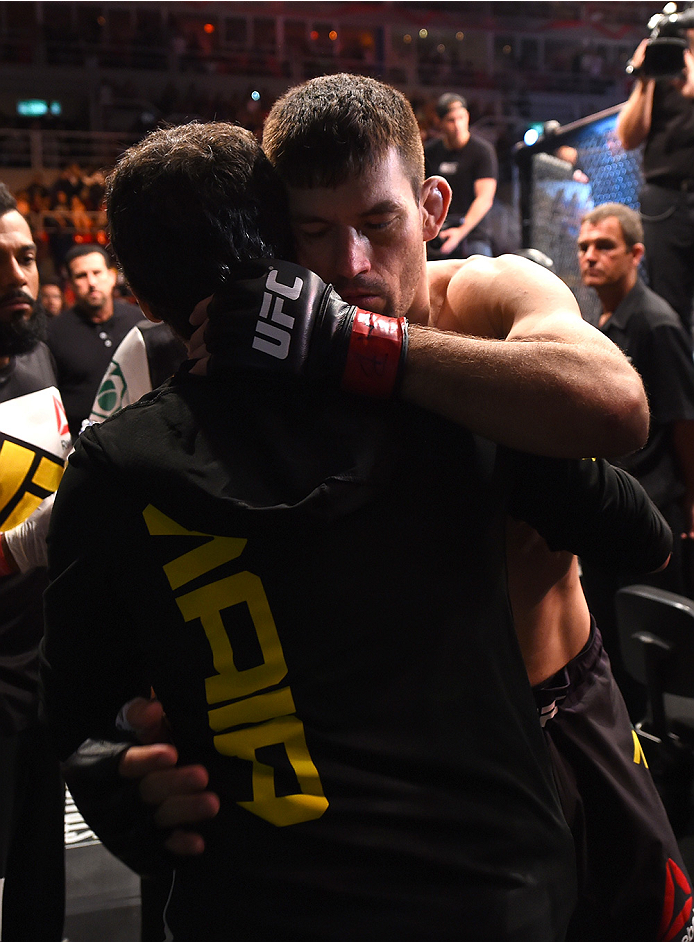 RIO DE JANEIRO, BRAZIL - AUGUST 01: Demian Maia of Brazil hugs his teammate before entering the Octagon to face Neil Magny of the United States in their welterweight bout during the UFC 190 event inside HSBC Arena on August 1, 2015 in Rio de Janeiro, Bra