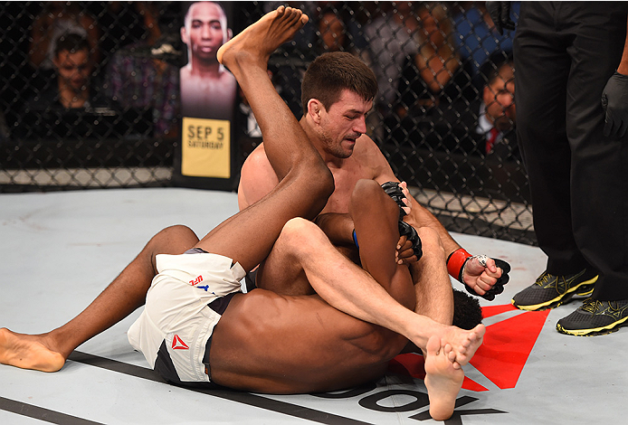 RIO DE JANEIRO, BRAZIL - AUGUST 01: Demian Maia of Brazil (top) attempts to submit Neil Magny of the United States in their welterweight bout during the UFC 190 event inside HSBC Arena on August 1, 2015 in Rio de Janeiro, Brazil. (Photo by Josh Hedges/Z