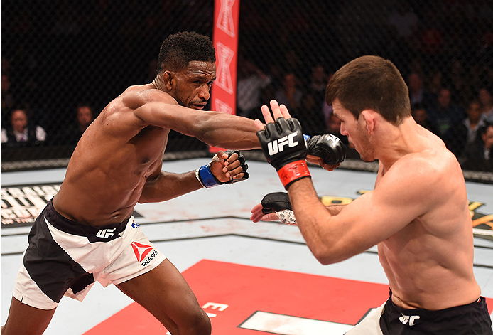 RIO DE JANEIRO, BRAZIL - AUGUST 01: (L-R) Neil Magny of the United States punches Demian Maia of Brazil in their welterweight bout during the UFC 190 event inside HSBC Arena on August 1, 2015 in Rio de Janeiro, Brazil. (Photo by Josh Hedges/Zuffa LLC/Zu