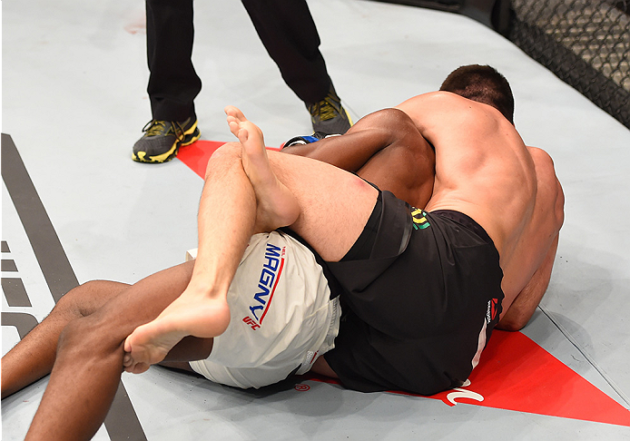 RIO DE JANEIRO, BRAZIL - AUGUST 01: Demian Maia of Brazil (top) submits Neil Magny of the United States in their welterweight bout during the UFC 190 event inside HSBC Arena on August 1, 2015 in Rio de Janeiro, Brazil. (Photo by Josh Hedges/Zuffa LLC/Zu