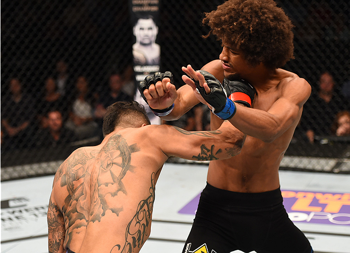 NEW ORLEANS, LA - JUNE 06: (L-R) Francisco Rivera punches Alex Caceres in their bantamweight bout during the UFC event at the Smoothie King Center on June 6, 2015 in New Orleans, Louisiana. (Photo by Josh Hedges/Zuffa LLC/Zuffa LLC via Getty Images)