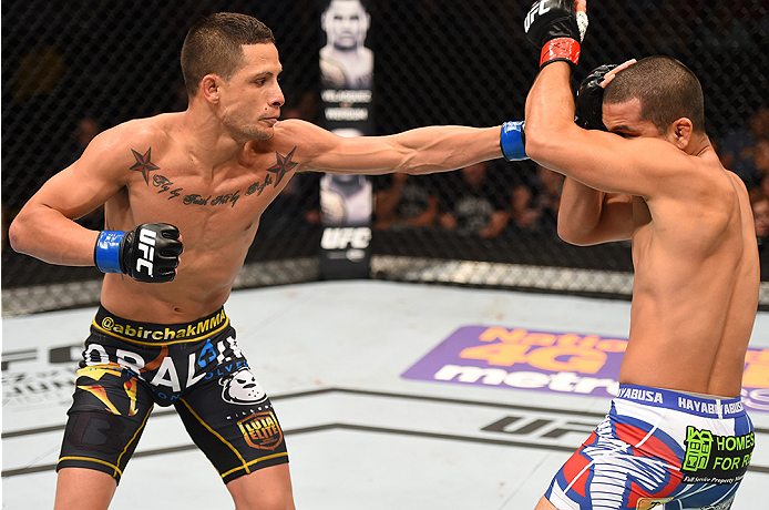 NEW ORLEANS, LA - JUNE 06: (L-R) Anthony Birchak punches Joe Soto in their bantamweight bout during the UFC event at the Smoothie King Center on June 6, 2015 in New Orleans, Louisiana. (Photo by Josh Hedges/Zuffa LLC/Zuffa LLC via Getty Images)