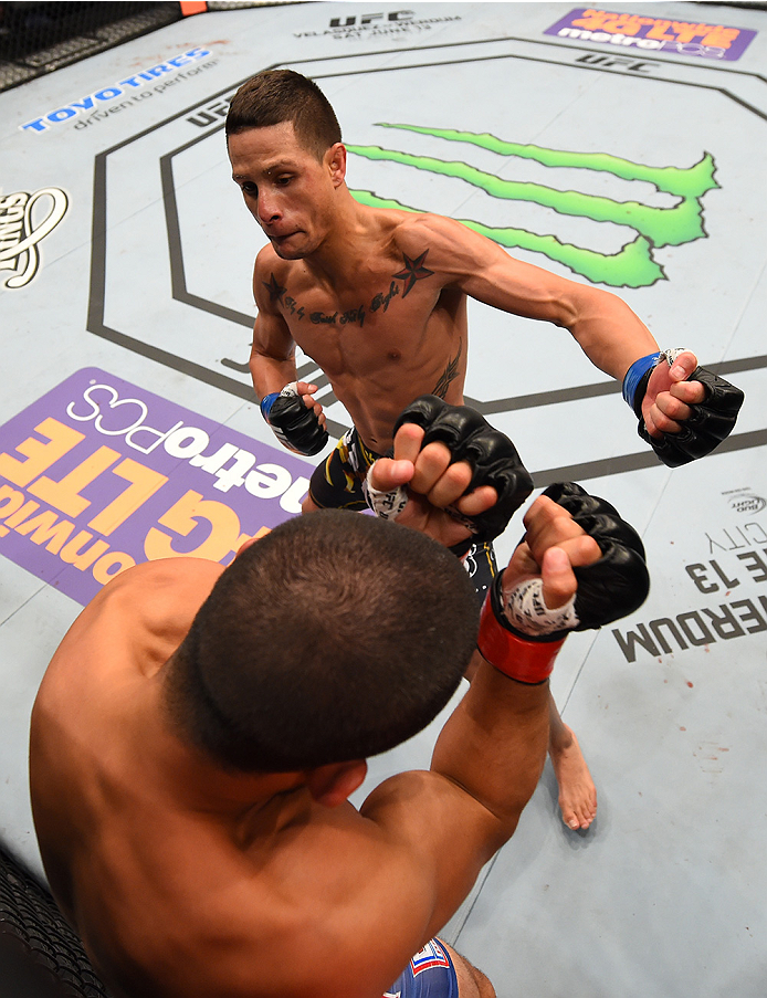 NEW ORLEANS, LA - JUNE 06: Anthony Birchak punches Joe Soto in their bantamweight bout during the UFC event at the Smoothie King Center on June 6, 2015 in New Orleans, Louisiana. (Photo by Josh Hedges/Zuffa LLC/Zuffa LLC via Getty Images)