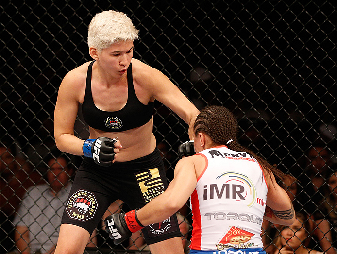 BRASILIA, BRAZIL - SEPTEMBER 13: (L-R) Larissa Pacheco of Brazil punches Jessica Andrade of Brazil in their women's bantamweight bout during the UFC Fight Night event inside Nilson Nelson Gymnasium on September 13, 2014 in Brasilia, Brazil. (Photo by Jo