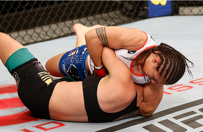 BRASILIA, BRAZIL - SEPTEMBER 13: Jessica Andrade of Brazil (top) secures a guillotine choke submission against Larissa Pacheco of Brazil in their women's bantamweight bout during the UFC Fight Night event inside Nilson Nelson Gymnasium on September 13, 2