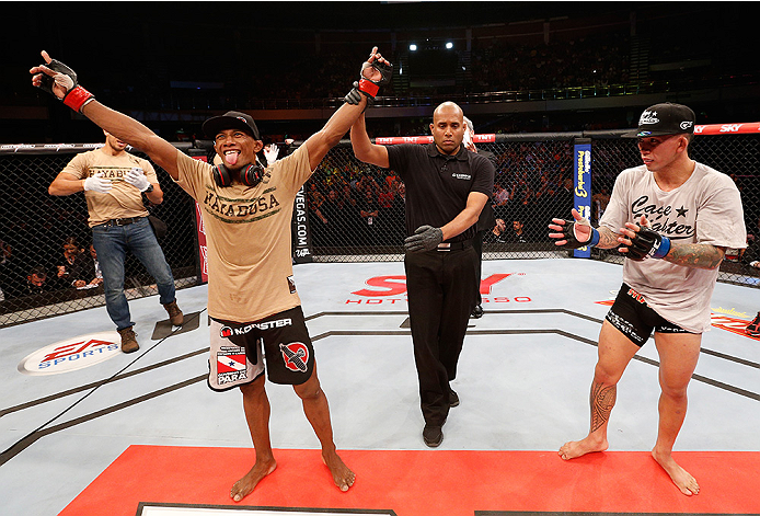 BRASILIA, BRAZIL - SEPTEMBER 13: Iuri Alcantara of Brazil celebrates after his unanimous-decision victory over Russell Doane in their bantamweight bout during the UFC Fight Night event inside Nilson Nelson Gymnasium on September 13, 2014 in Brasilia, Braz
