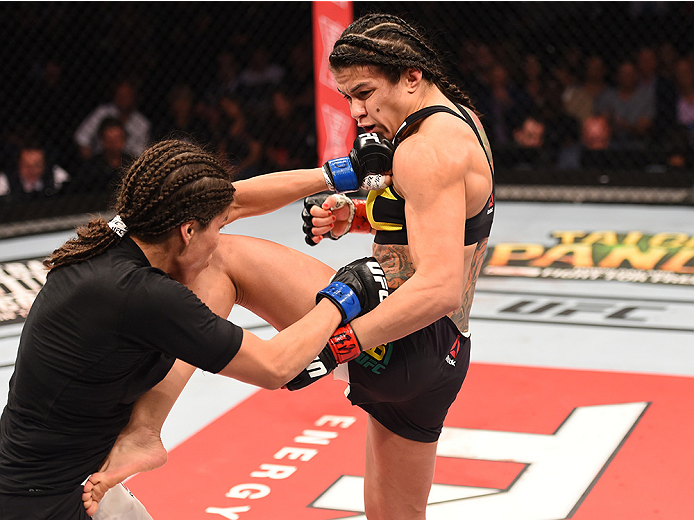RIO DE JANEIRO, BRAZIL - AUGUST 01: (R-L) Claudia Gadelha of Brazil kicks Jessica Aguilar of the United States in their women's strawweight bout during the UFC 190 event inside HSBC Arena on August 1, 2015 in Rio de Janeiro, Brazil. (Photo by Josh Hedge