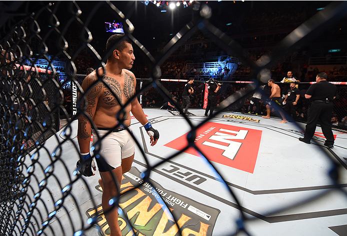 RIO DE JANEIRO, BRAZIL - AUGUST 01: (L-R) Soa Palelei of Australia enters the Octagon before facing Antonio 'Bigfoot' Silva of Brazil in their heavyweight bout during the UFC 190 event inside HSBC Arena on August 1, 2015 in Rio de Janeiro, Brazil. (Phot