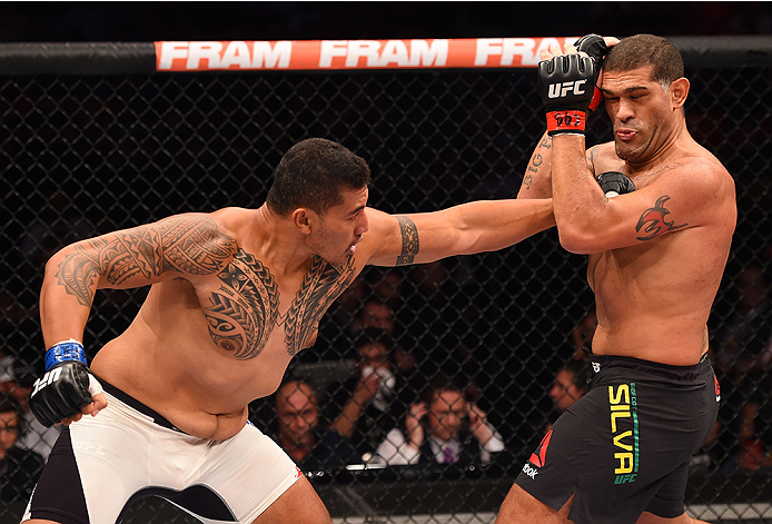 RIO DE JANEIRO, BRAZIL - AUGUST 01: (L-R) Soa Palelei of Australia punches Antonio 'Bigfoot' Silva of Brazil in their heavyweight bout during the UFC 190 event inside HSBC Arena on August 1, 2015 in Rio de Janeiro, Brazil. (Photo by Josh Hedges/Zuffa LL