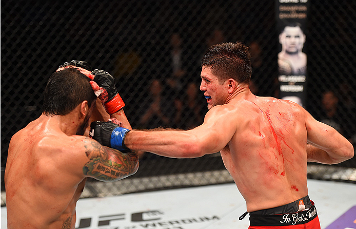 NEW ORLEANS, LA - JUNE 06: (R-L) Brian Ortega punches Thiago Tavares in their featherweight bout during the UFC event at the Smoothie King Center on June 6, 2015 in New Orleans, Louisiana. (Photo by Josh Hedges/Zuffa LLC/Zuffa LLC via Getty Images)