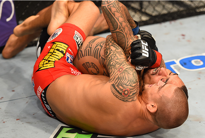 NEW ORLEANS, LA - JUNE 06: Dustin Poirier attempts to submit Yancy Medeiros in their lightweight bout during the UFC event at the Smoothie King Center on June 6, 2015 in New Orleans, Louisiana. (Photo by Josh Hedges/Zuffa LLC/Zuffa LLC via Getty Images)