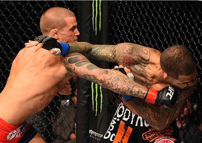 NEW ORLEANS, LA - JUNE 06: (L-R) Dustin Poirier punches Yancy Medeiros in their lightweight bout during the UFC event at the Smoothie King Center on June 6, 2015 in New Orleans, Louisiana. (Photo by Josh Hedges/Zuffa LLC/Zuffa LLC via Getty Images)