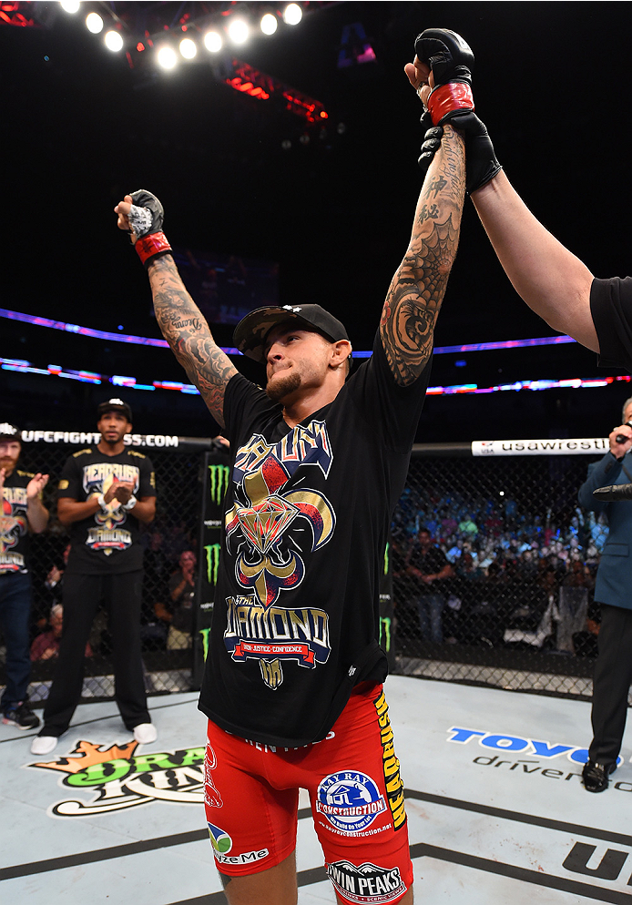 NEW ORLEANS, LA - JUNE 06: Dustin Poirier celebrates his victory over Yancy Medeiros in their lightweight bout during the UFC event at the Smoothie King Center on June 6, 2015 in New Orleans, Louisiana. (Photo by Josh Hedges/Zuffa LLC/Zuffa LLC via Getty