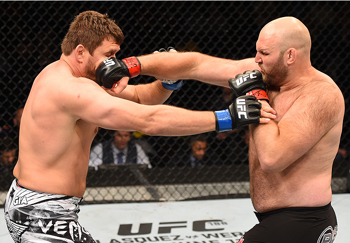 NEW ORLEANS, LA - JUNE 06: (R-L) Ben Rothwell punches Matt Mitrione in their heavyweight bout during the UFC event at the Smoothie King Center on June 6, 2015 in New Orleans, Louisiana. (Photo by Josh Hedges/Zuffa LLC/Zuffa LLC via Getty Images)