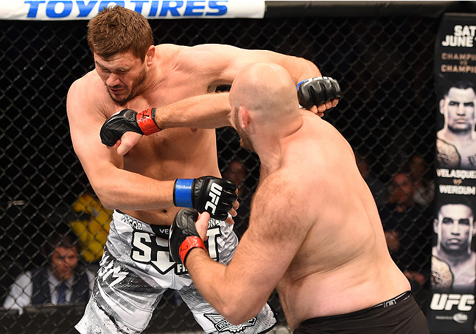 NEW ORLEANS, LA - JUNE 06: (R-L) Ben Rothwell punches Matt Mitrione in their heavyweight bout during the UFC event at the Smoothie King Center on June 6, 2015 in New Orleans, Louisiana. (Photo by Josh Hedges/Zuffa LLC/Zuffa LLC via Getty Images)