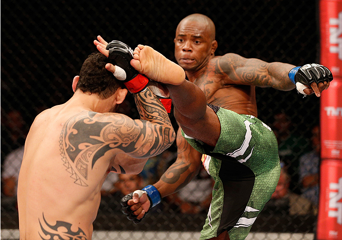 BRASILIA, BRAZIL - SEPTEMBER 13: (R-L) Wendell Oliveira of Brazil kicks Santiago Ponzinibbio of Argentina in their welterweight bout during the UFC Fight Night event inside Nilson Nelson Gymnasium on September 13, 2014 in Brasilia, Brazil. (Photo by Jo