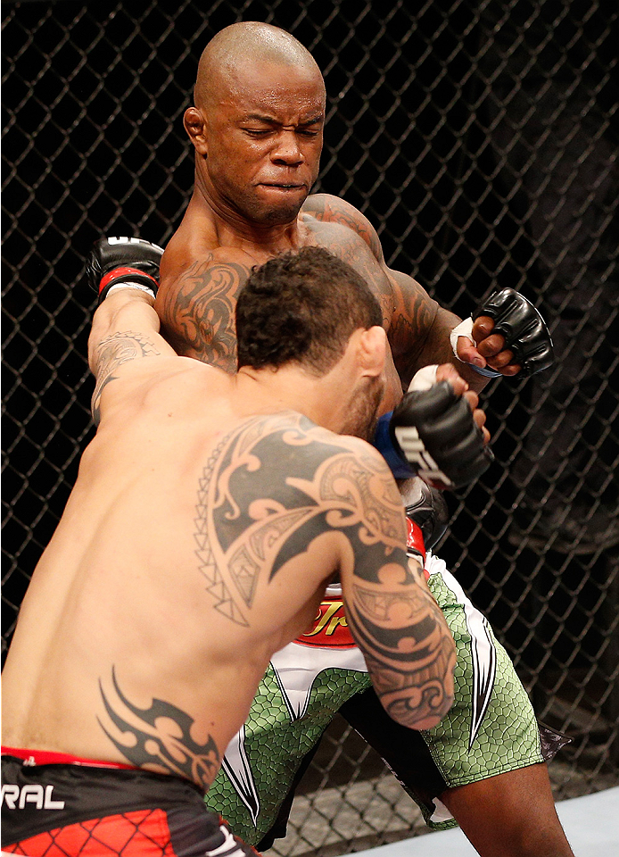 BRASILIA, BRAZIL - SEPTEMBER 13: (R-L) Wendell Oliveira of Brazil punches Santiago Ponzinibbio of Argentina in their welterweight bout during the UFC Fight Night event inside Nilson Nelson Gymnasium on September 13, 2014 in Brasilia, Brazil. (Photo by