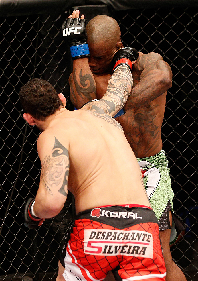 BRASILIA, BRAZIL - SEPTEMBER 13: (L-R) Santiago Ponzinibbio of Argentina knocks out Wendell Oliveira of Brazil with a series of punches in their welterweight bout during the UFC Fight Night event inside Nilson Nelson Gymnasium on September 13, 2014 in B