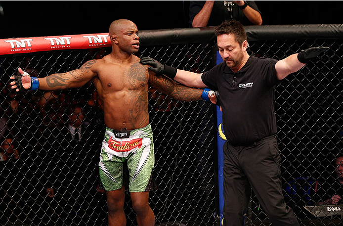 BRASILIA, BRAZIL - SEPTEMBER 13: (L-R) Wendell Oliveira of Brazil protests to referee Mario Yamasaki after his knockout loss to Santiago Ponzinibbio of Argentina in their welterweight bout during the UFC Fight Night event inside Nilson Nelson Gymnasium