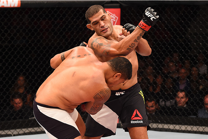 RIO DE JANEIRO, BRAZIL - AUGUST 01: (R-L) Antonio 'Bigfoot' Silva of Brazil punches Soa Palelei of Australia in their heavyweight bout during the UFC 190 event inside HSBC Arena on August 1, 2015 in Rio de Janeiro, Brazil. (Photo by Josh Hedges/Zuffa LL