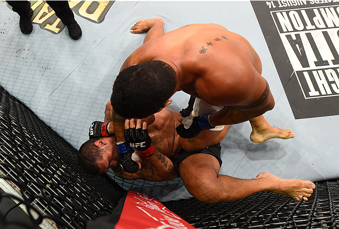 RIO DE JANEIRO, BRAZIL - AUGUST 01: Soa Palelei of Australia (top) punches Antonio 'Bigfoot' Silva of Brazil in their heavyweight bout during the UFC 190 event inside HSBC Arena on August 1, 2015 in Rio de Janeiro, Brazil. (Photo by Josh Hedges/Zuffa LL