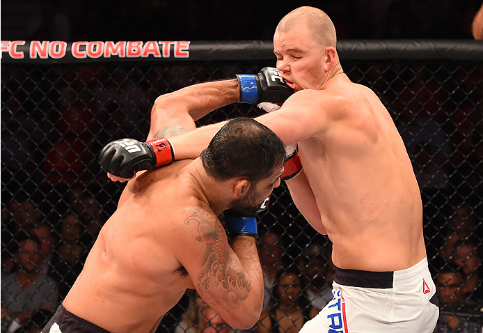 RIO DE JANEIRO, BRAZIL - AUGUST 01: (L-R) Rodrigo 'Minotauro' Nogueira of Brazil punches Stefan Struve of the Netherlands in their heavyweight bout during the UFC 190 event inside HSBC Arena on August 1, 2015 in Rio de Janeiro, Brazil. (Photo by Josh He