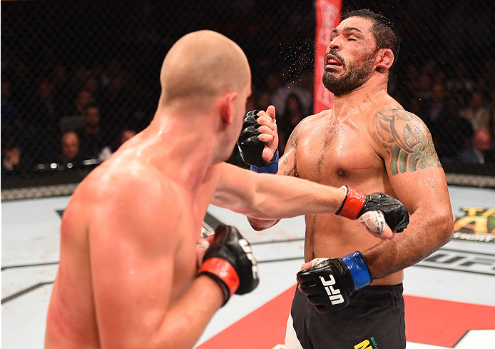 RIO DE JANEIRO, BRAZIL - AUGUST 01: (L-R) Stefan Struve of the Netherlands punches Rodrigo 'Minotauro' Nogueira of Brazil in their heavyweight bout during the UFC 190 event inside HSBC Arena on August 1, 2015 in Rio de Janeiro, Brazil. (Photo by Josh H