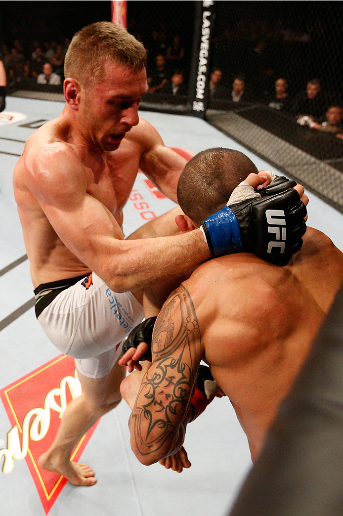 BRASILIA, BRAZIL - SEPTEMBER 13: (L-R) Piotr Hallmann of Poland knees Gleison Tibau of Brazil in their lightweight bout during the UFC Fight Night event inside Nilson Nelson Gymnasium on September 13, 2014 in Brasilia, Brazil. (Photo by Josh Hedges/Zuffa