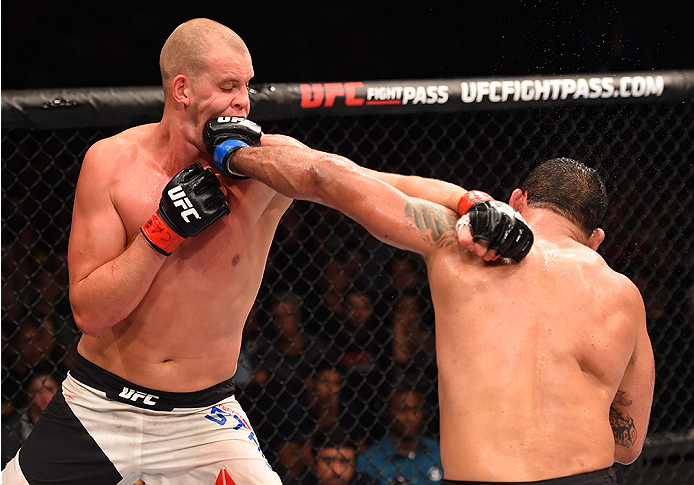 RIO DE JANEIRO, BRAZIL - AUGUST 01: (R-L) Rodrigo 'Minotauro' Nogueira of Brazil punches Stefan Struve of the Netherlands in their heavyweight bout during the UFC 190 event inside HSBC Arena on August 1, 2015 in Rio de Janeiro, Brazil. (Photo by Josh He