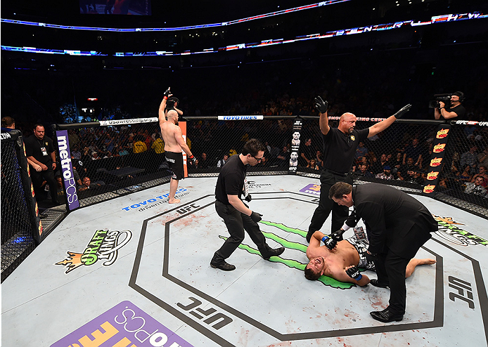 NEW ORLEANS, LA - JUNE 06: (L-R) Ben Rothwell celebrates his submission victory over Matt Mitrione in their heavyweight bout during the UFC event at the Smoothie King Center on June 6, 2015 in New Orleans, Louisiana. (Photo by Josh Hedges/Zuffa LLC/Zuff