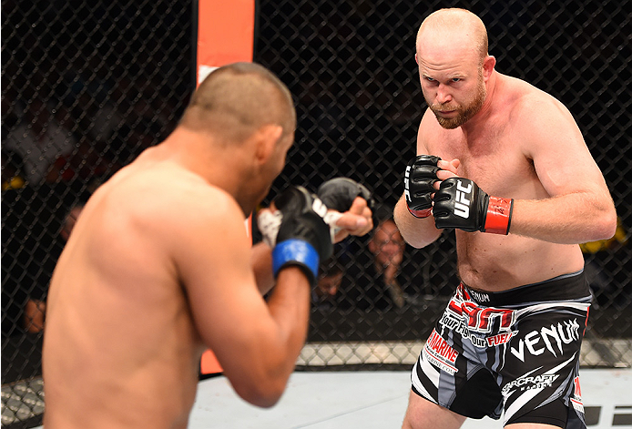 NEW ORLEANS, LA - JUNE 06: (R-l) Tim Boetsch circles Dan Henderson in their middleweight bout during the UFC event at the Smoothie King Center on June 6, 2015 in New Orleans, Louisiana. (Photo by Josh Hedges/Zuffa LLC/Zuffa LLC via Getty Images)