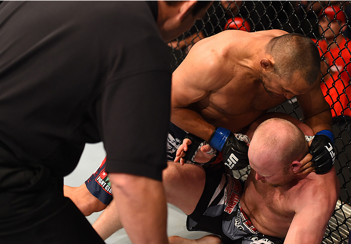 NEW ORLEANS, LA - JUNE 06: Dan Henderson punches Tim Boetsch in their middleweight bout during the UFC event at the Smoothie King Center on June 6, 2015 in New Orleans, Louisiana. (Photo by Josh Hedges/Zuffa LLC/Zuffa LLC via Getty Images)