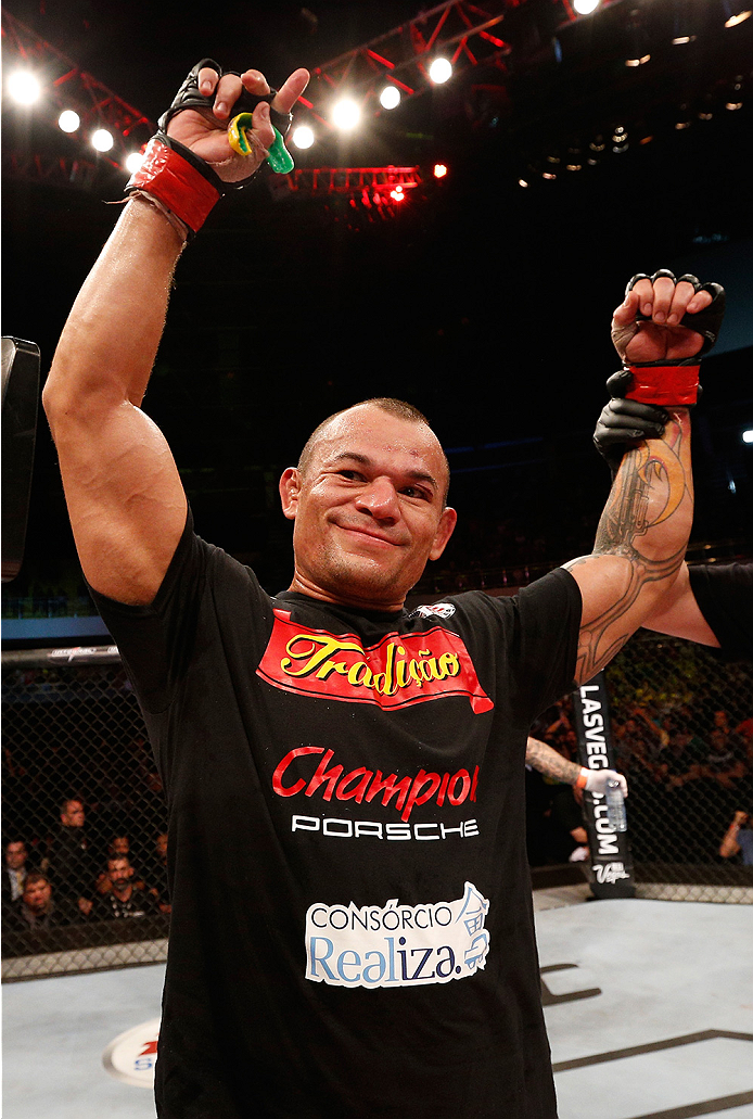 BRASILIA, BRAZIL - SEPTEMBER 13: Gleison Tibau of Brazil celebrates after his split-decision victory over Piotr Hallmann of Poland in their lightweight bout during the UFC Fight Night event inside Nilson Nelson Gymnasium on September 13, 2014 in Brasilia,