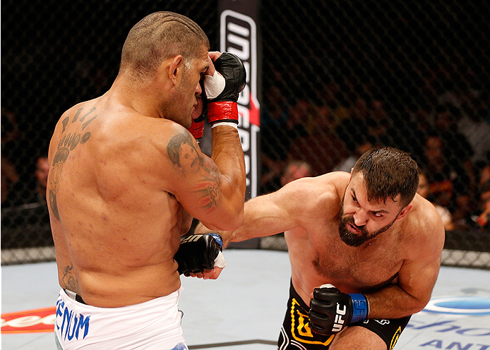 BRASILIA, DF - SEPTEMBER 13: (R-L) Andrei Arlovski of Belarus lands an uppercut against Antonio "Bigfoot" Silva of Brazil in their heavyweight bout during the UFC Fight Night event inside Nilson Nelson Gymnasium on September 13, 2014 in Brasilia, Brazil.