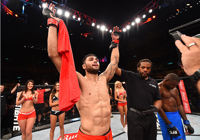 RIO DE JANEIRO, BRAZIL - AUGUST 01: (L-R) Glaico Franca of Brazil celebrates his submission victory over Fernando Bruno of Brazil in their lightweight bout during the UFC 190 event inside HSBC Arena on August 1, 2015 in Rio de Janeiro, Brazil. (Photo by
