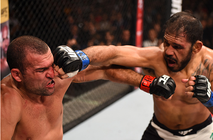 RIO DE JANEIRO, BRAZIL - AUGUST 01: (R-L) Rogerio Nogueira of Brazil punches Mauricio 'Shogun' Rua of Brazil in their light heavyweight bout during the UFC 190 event inside HSBC Arena on August 1, 2015 in Rio de Janeiro, Brazil. (Photo by Josh Hedges/Zu