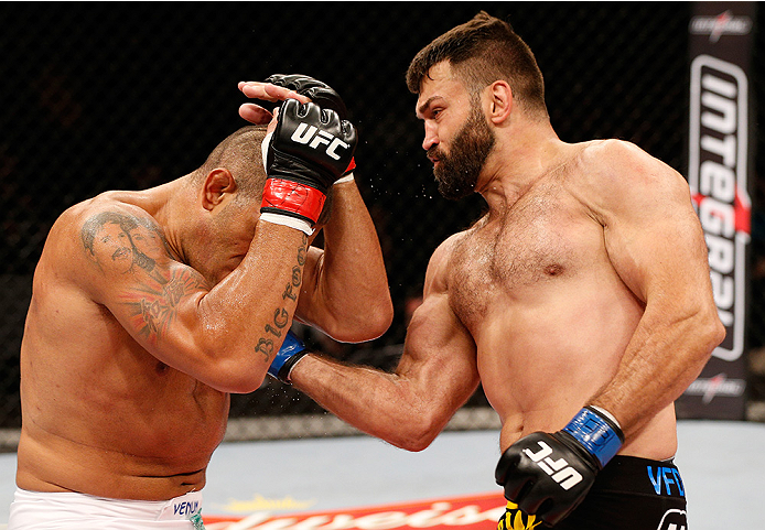 BRASILIA, BRAZIL - SEPTEMBER 13: (R-L) Andrei Arlovski of Belarus lands an uppercut against Antonio "Bigfoot" Silva of Brazil in their heavyweight bout during the UFC Fight Night event inside Nilson Nelson Gymnasium on September 13, 2014 in Brasilia, Bra