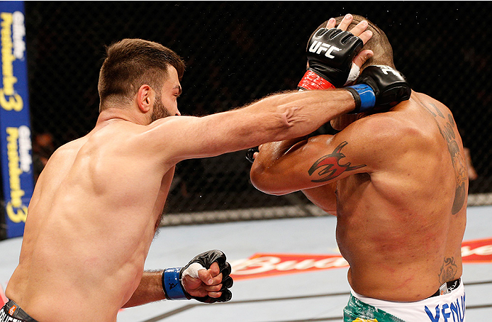 BRASILIA, DF - SEPTEMBER 13: (L-R) Andrei Arlovski of Belarus lands an uppercut against Antonio "Bigfoot" Silva of Brazil in their heavyweight bout during the UFC Fight Night event inside Nilson Nelson Gymnasium on September 13, 2014 in Brasilia, Brazil.