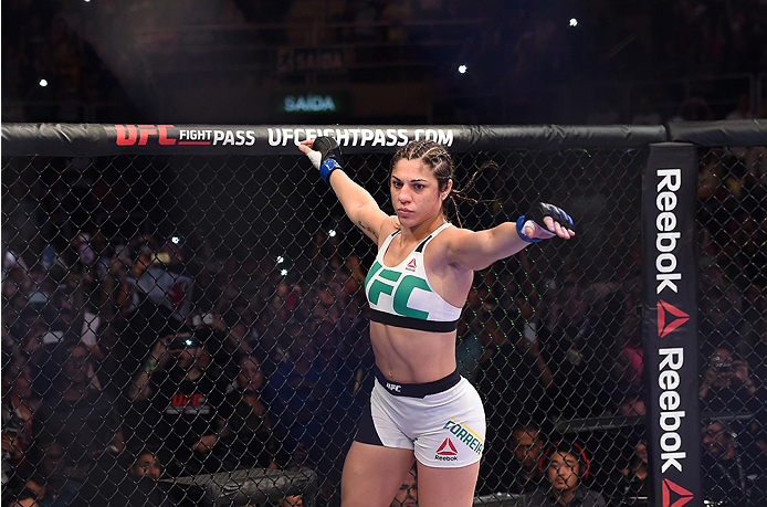 RIO DE JANEIRO, BRAZIL - AUGUST 01: Bethe Correia of Brazil enters the Octagon before facing Ronda Rousey of the United States in their UFC women's bantamweight championship bout during the UFC 190 event inside HSBC Arena on August 1, 2015 in Rio de Jane