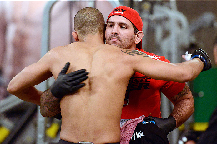 LACHUTE, CANADA - DECEMBER 6: Team Canada fighter Kajan Johnson greets his corner before taking on Team Canada fighter Chad Laprise in their semifinal middleweight fight during filming of The Ultimate Fighter Nations television series on December 6, 2013