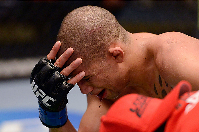 LACHUTE, CANADA - DECEMBER 6: Team Canada fighter Kajan Johnson hangs his head after being knocked out by Team Canada fighter Chad Laprise in their semifinal middleweight fight during filming of The Ultimate Fighter Nations television series on December